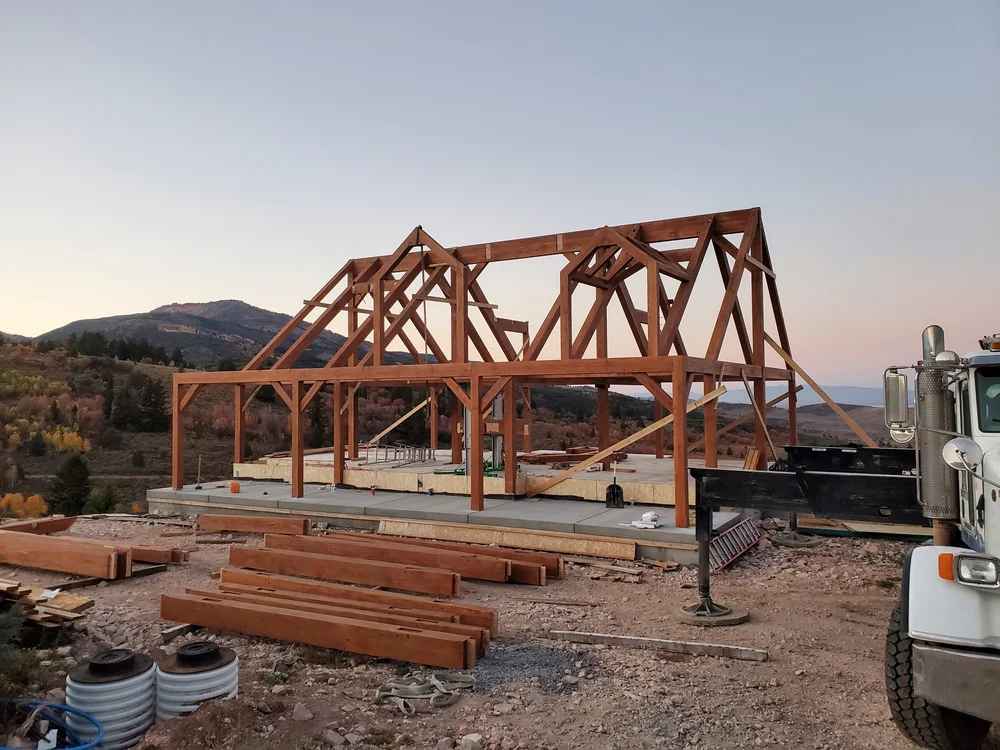 Timber frames being fabricated at the Mountain West Timber shop