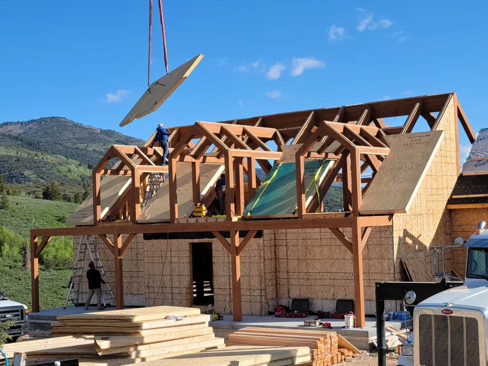 Crew installing timber frames on site